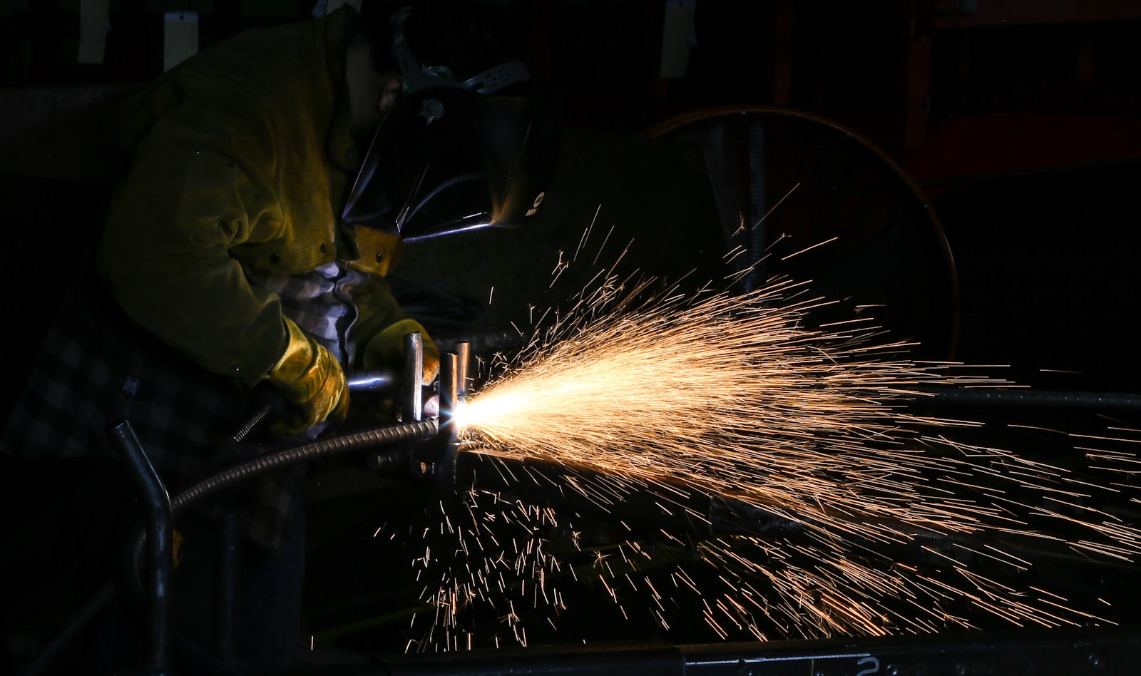 A robotic arc weld throwing sparks